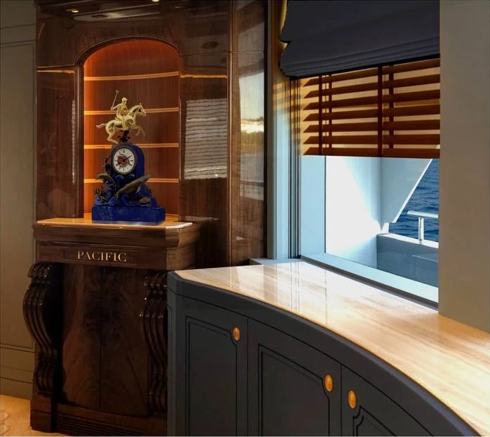 The completed 53-metre yacht alcove, with its clock, wood cabinetry and marble counter.
