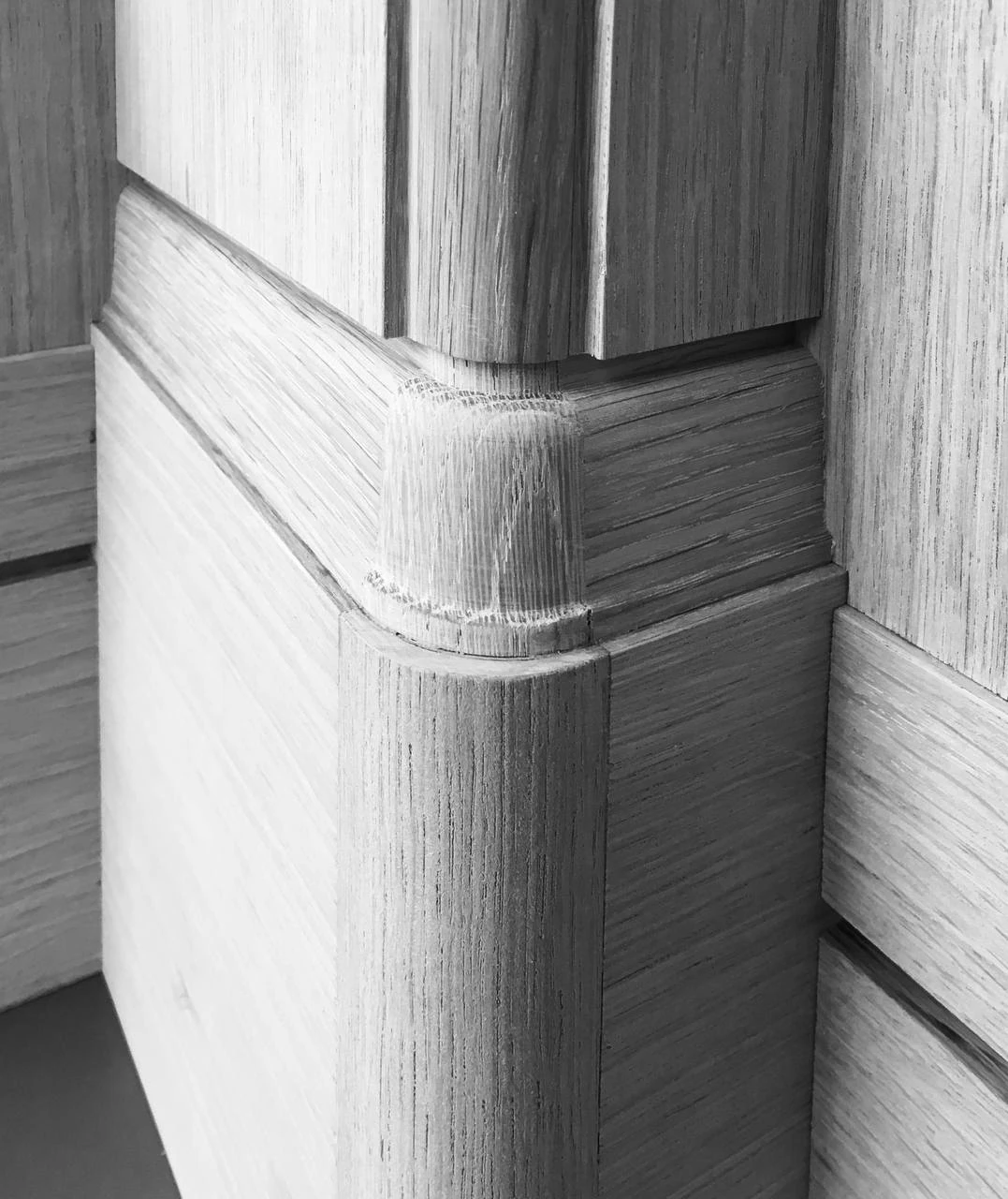 Black-and-white study of rounded timber joinery
