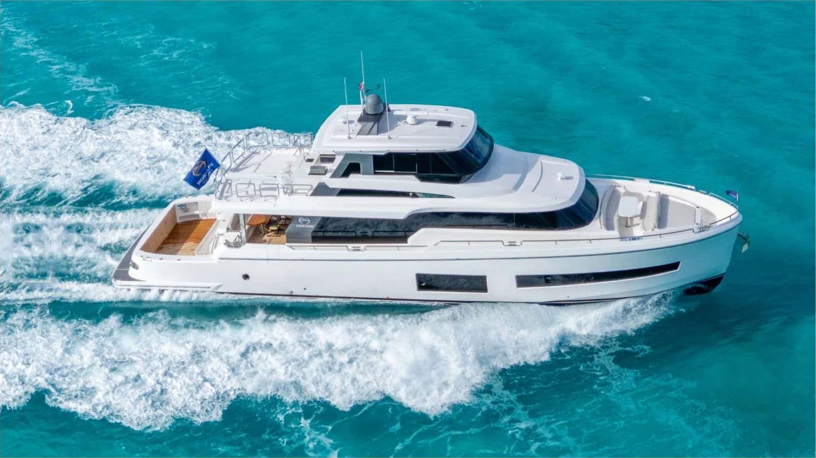 Motor yacht exterior viewed from above, underway